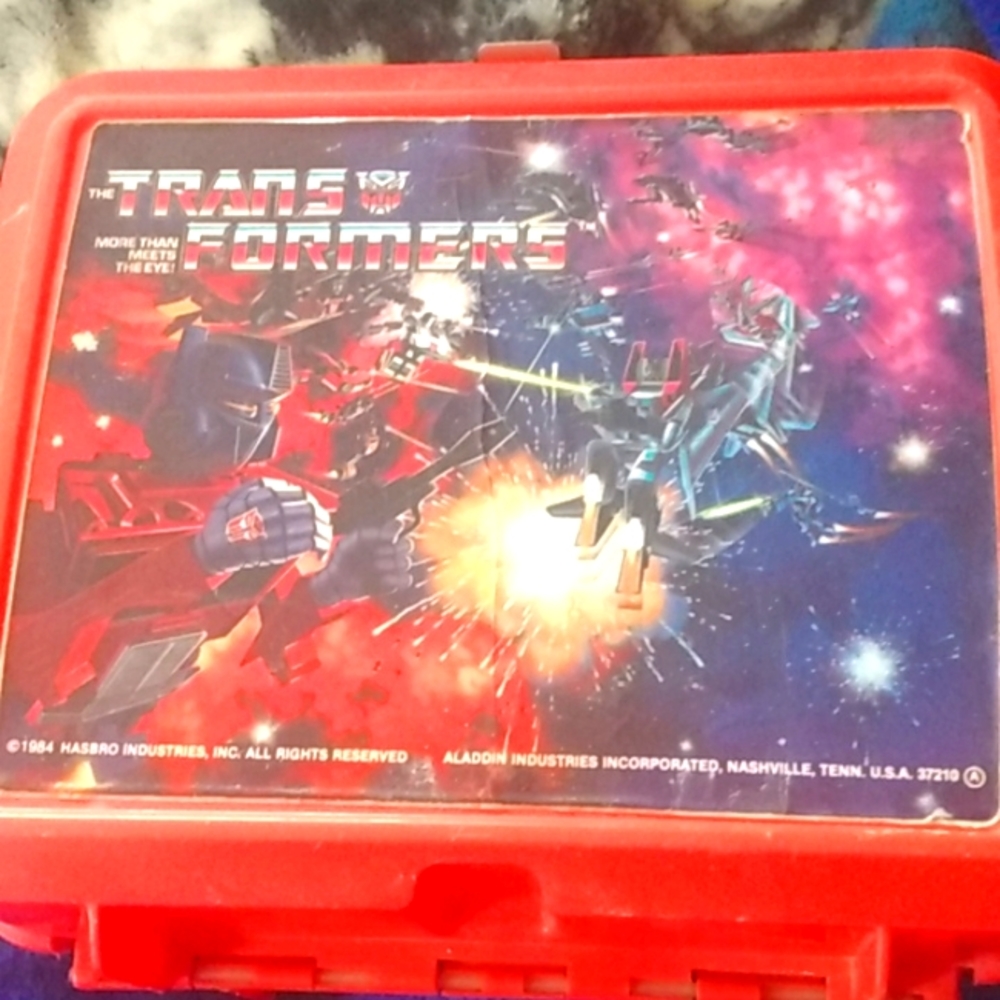 Aladdin lunch box/ transformers